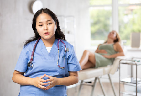 Portrait of female cosmetologist standing in cosmetology clinicの写真素材