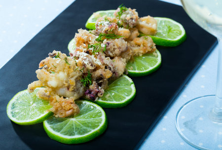 Fried calamari and sepia in a batter of tempera flour and glass of wine