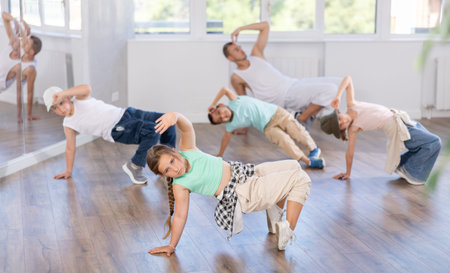 Group of children dancers having break dance training at dance studio