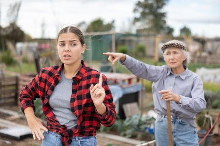 Conflict between female neighbors in country farmの写真素材