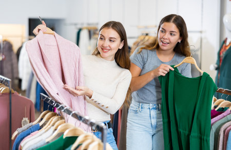 Woman with personal shopper shopping in storeの写真素材