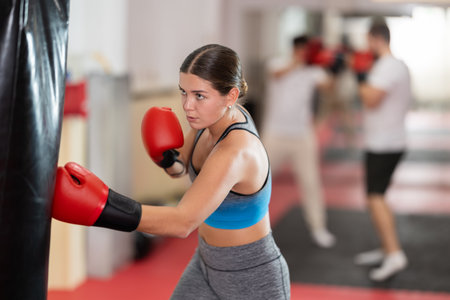 Woman training in boxing sectionの写真素材