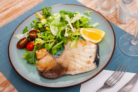 Roasted porbeagle steak with green salad and lemon