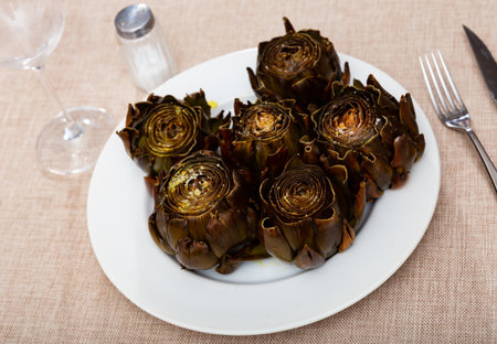 Cooked artichoke on a plate in the view from aboveの写真素材