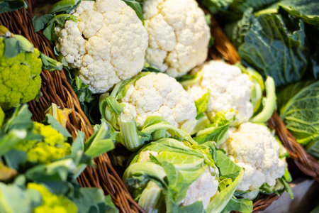 View of cauliflower in a wicker basket, put up for sale in store