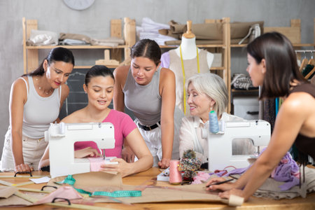 Middle-aged Asian woman showing how to sewの写真素材