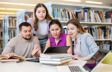 Group of students learning together at libraryの写真素材