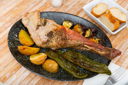 Roasted lamb shoulder with vegetablesの写真素材