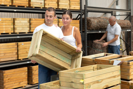 Couple customers choose wooden box in store.の写真素材
