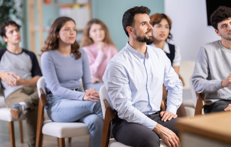 Students sit attentively in the classroom and listen to lectures