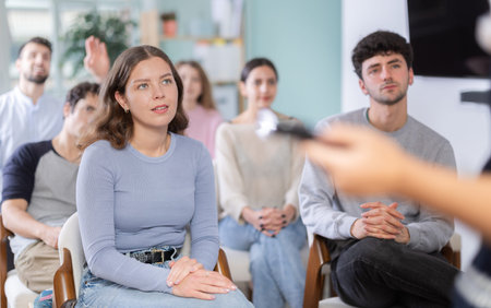 Students sit attentively in the classroom and listen to lectures