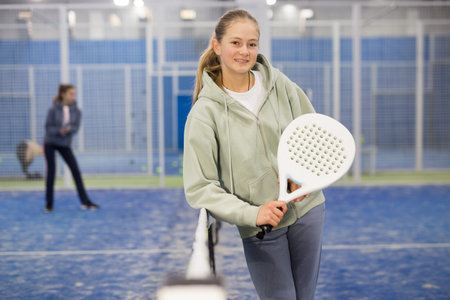 Portrait of teenage girl padel playerの写真素材