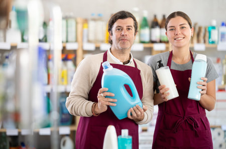 Store manager and sales assistant offering cleaning and care productsの写真素材