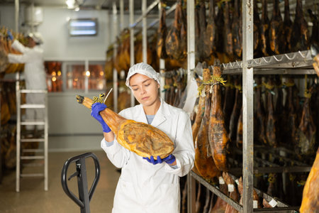 Employee checks jamon. Quality controlの写真素材