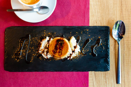 Caramel pudding dessert. Flan with cream