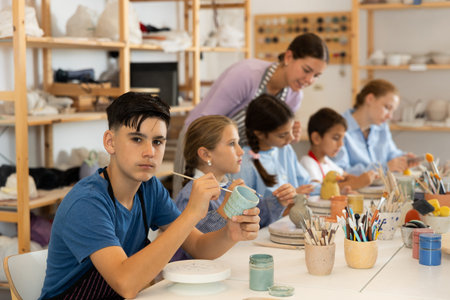 Boy at a master class for children on ceramics