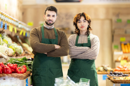 Portrait of man and woman - employees of grocery supermarketの写真素材