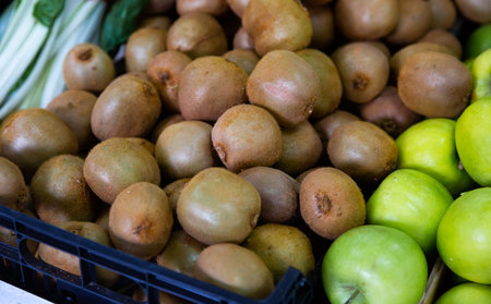Closeup view on the pile of kiwi fruit on the marketの写真素材