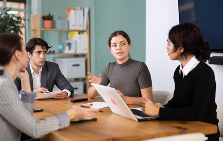 Young woman holding meeting in office