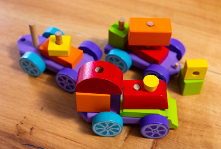 Colorful wooden train toy for preschool aged kids closeup