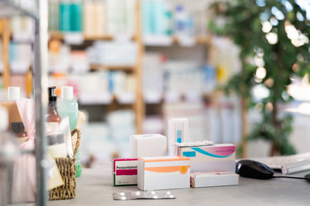 Medicines and hygiene products on counter of pharmacyの写真素材