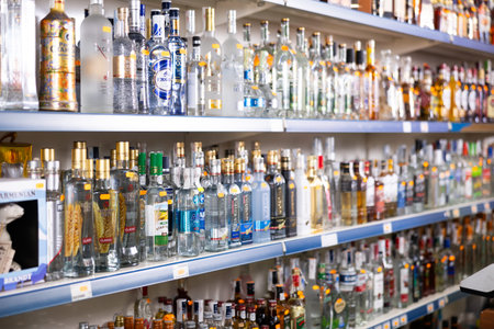 BADALONA, SPAIN - February 12, 2024: Bottles of Russian vodka on shelves of a Russian alcohol store in Spainのeditorial素材