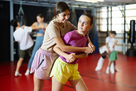 Teenage girls learn punches