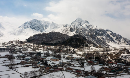 Aerial view of mountainous Georgian village Sioni covered with snowの写真素材