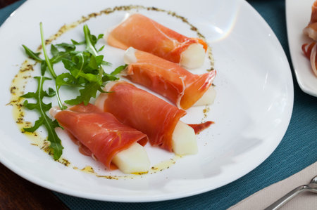 Sliced jamon with fresh juicy melon