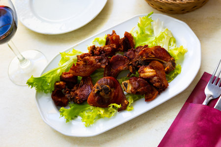 Grilled pork spare meal with garnish of french fries and leaf saladの写真素材