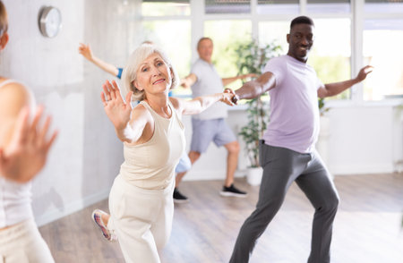 Group of multiethnic mature people dancing social dance