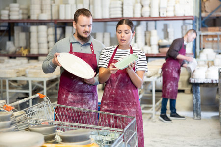 Man and woman talking about finished dishes