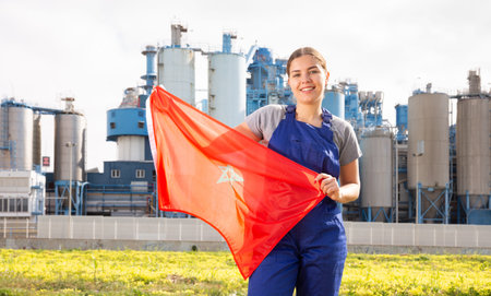 Positive young woman holds the national flag of Moroccoの写真素材