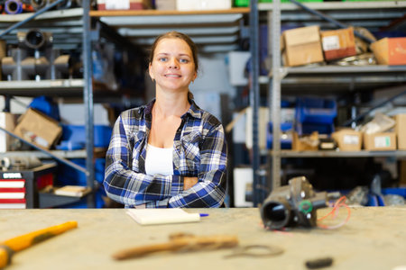 Young smiling girl posing at workplace