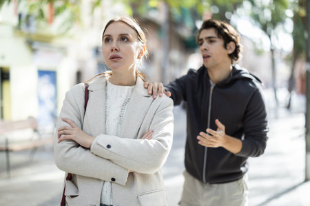 Quarrel between guy and girl during walk.