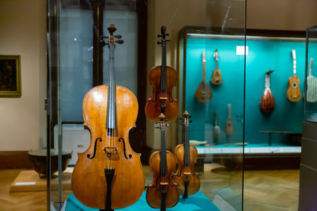 Showcase with bowed string instruments in Weltmuseum Wien, Austria
