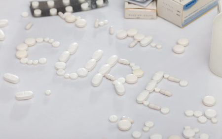Word CURE lined with tablets
