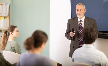 teacher gives a lecture to students