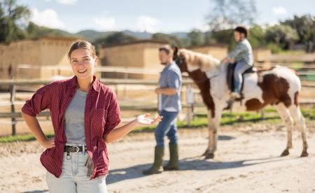 Young woman posing in horse pen