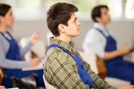 guy builder listens to a lecture in the classroom