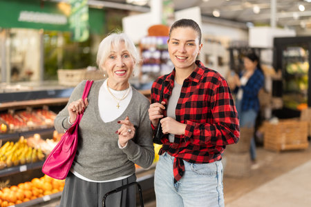 Family shopping at supermarket - choosing something in grocery section of supermarket