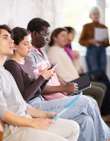 People are sitting in line and waiting for an interviewの写真素材