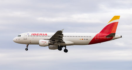 Airplane Iberia airline lands on runway in an airport Josep Tarradellas, city of Barcelona