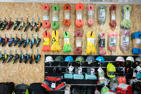 On wall of showcase - hang goods for travelers and tourists - safety harnesses, ropes, carabiners