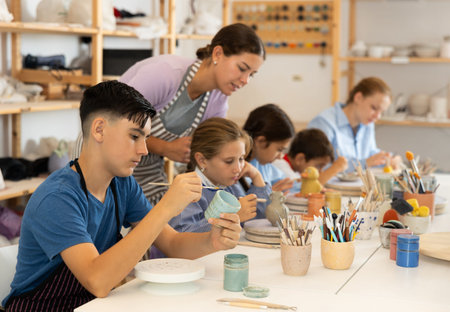 Boy at a master class for children on ceramics