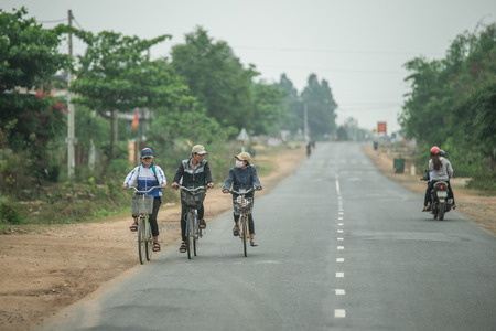 NHA TRANG - VIETNAM, APRIL 19 : people come back home by bicycle in nha trang, April 19, 2015のeditorial素材