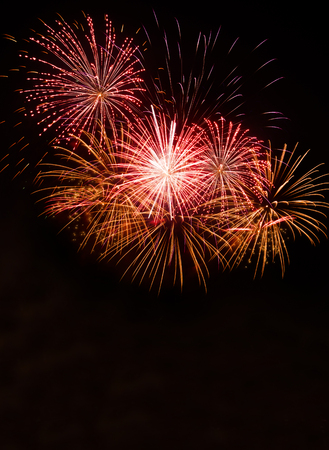 Green colorful fireworks in black backgroundの写真素材
