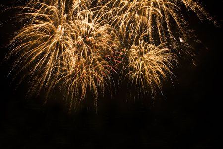 Green colorful fireworks in black backgroundの写真素材