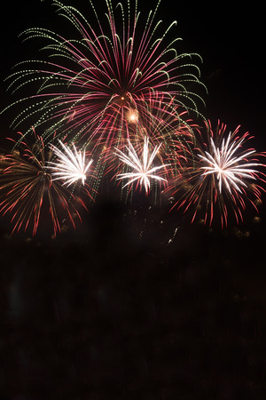 Green colorful fireworks in black backgroundの写真素材