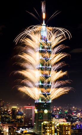 TAIPEI, TAIWAN - JANUARY 1, 2017 - Fireworks ring in the 2017 New Year at the Taipei 101 building.